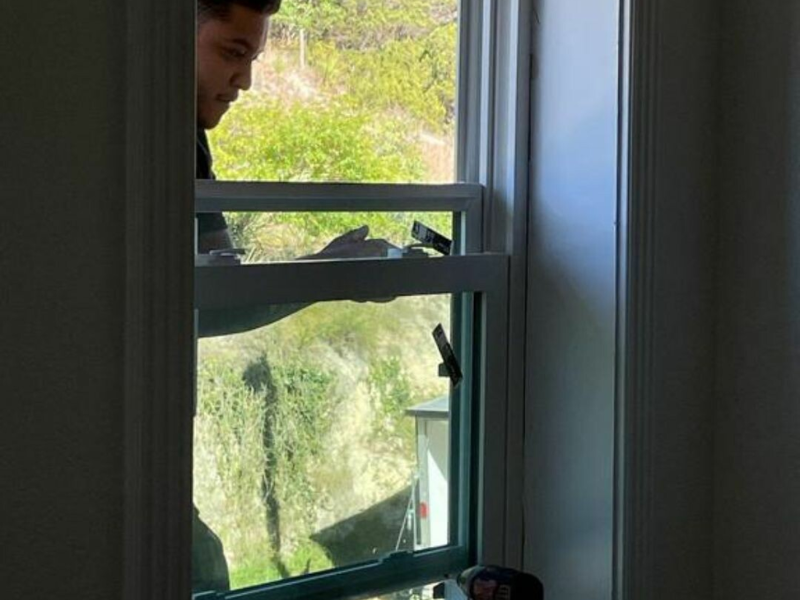 An image showing professional window installation by Spartan Roofing &amp; Siding in San Antonio. 