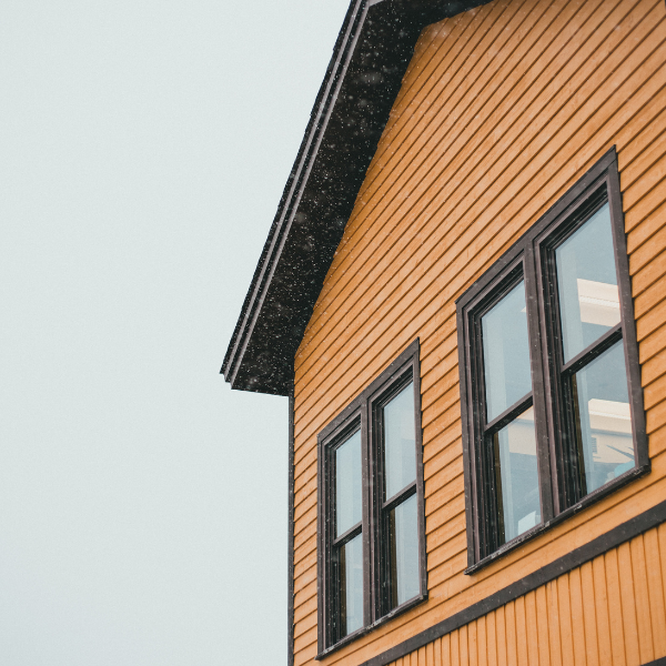 An image showing professional siding repair on a home in San Antonio.