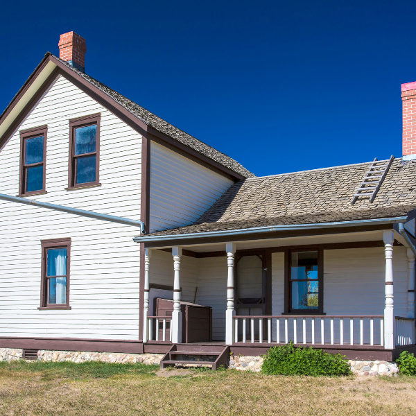 Image showing a home with worn-out siding in San Antonio.