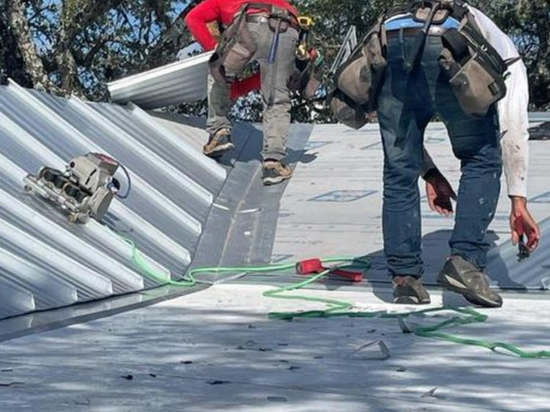 An image showing Spartan Roofing &amp; siding installing a metal roof in San Antonio. 