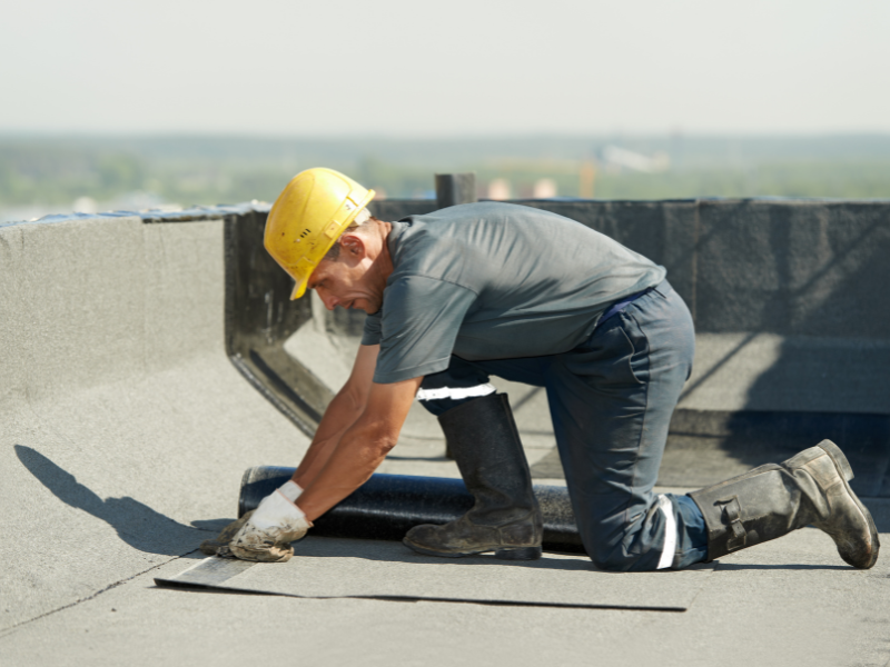 An image showing commercial roofing systems being installed by an expert in San Antonio, TX. 