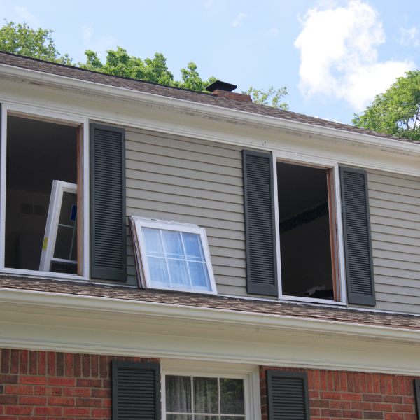 An image showing energy-efficient windows being installed in a home.