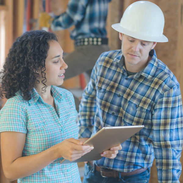 Image showing a homeowner receiving a siding quote from a contractor.