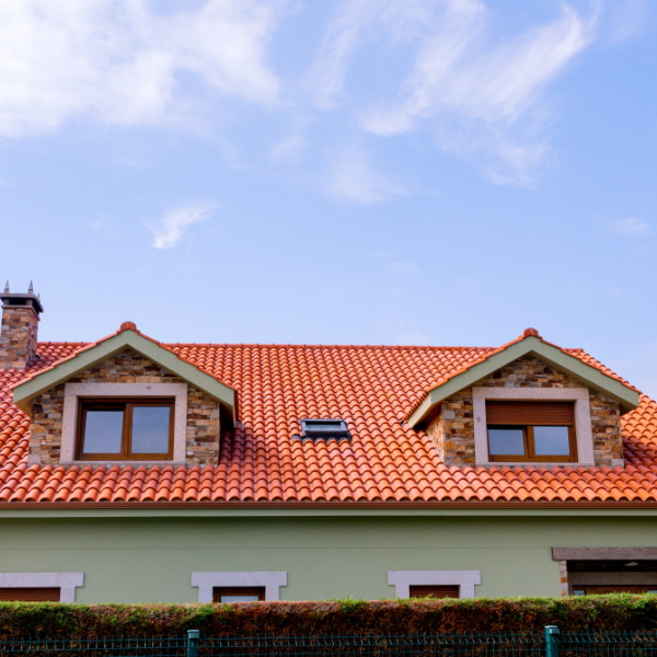 Picture of a beautiful home with tile roofing.