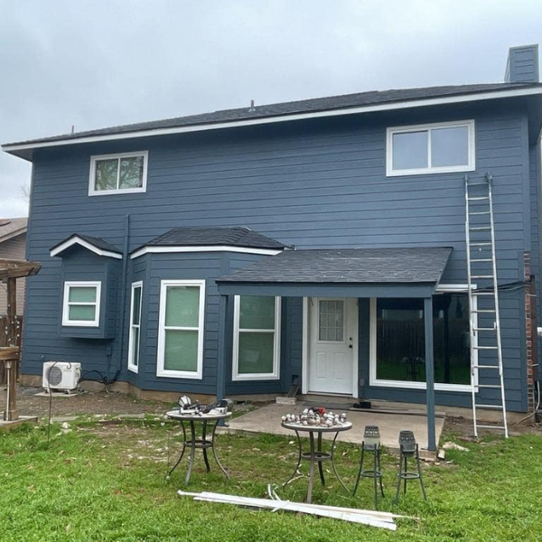 Picture of a beautiful home exterior with new concrete fiber siding in San Antonio: installed by Spartan Roofing &amp; Siding.