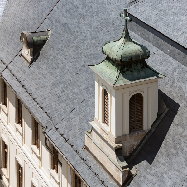An image showing a historic building with a slate roof in San Antonio.