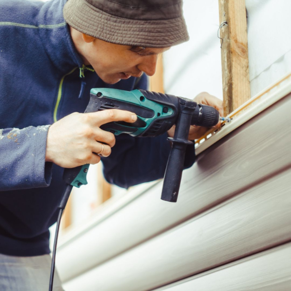 Image showing professional siding installers at work in San Antonio.