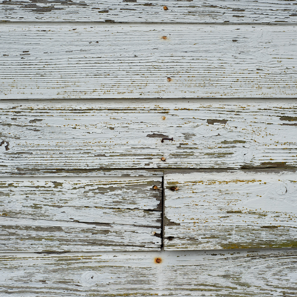 An image showing siding with wear and tear, requiring new installation or repair in San Antonio, TX. 