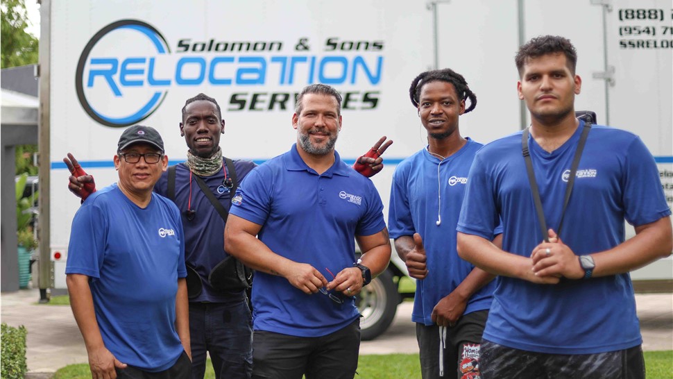 Solomon & Sons employees in front of Fort Lauderdale home moving truck.