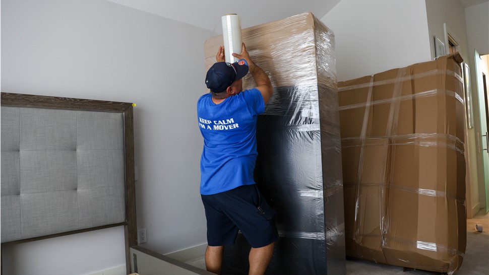 Packing furniture by Miami household movers