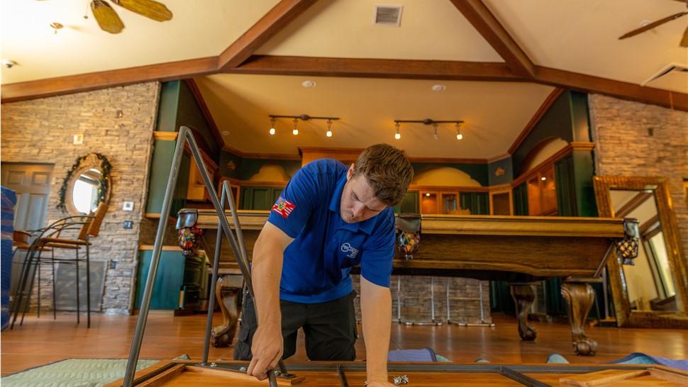 Miami mover assembling a table.