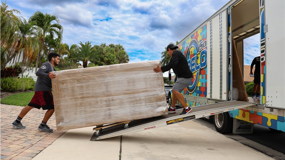 Loading furnature into South Florida moving truck for household move.