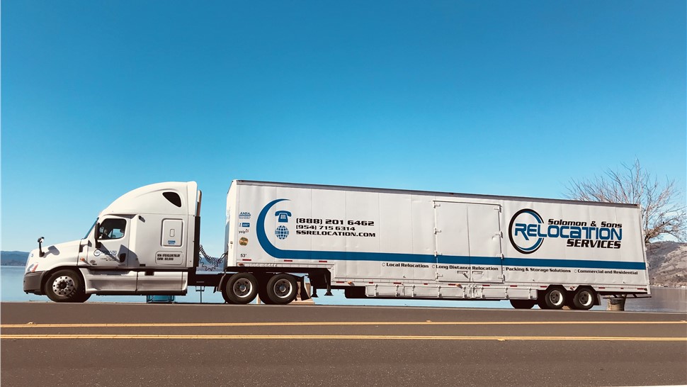 Solomon & Sons moving truck on the highway for cross-country move.