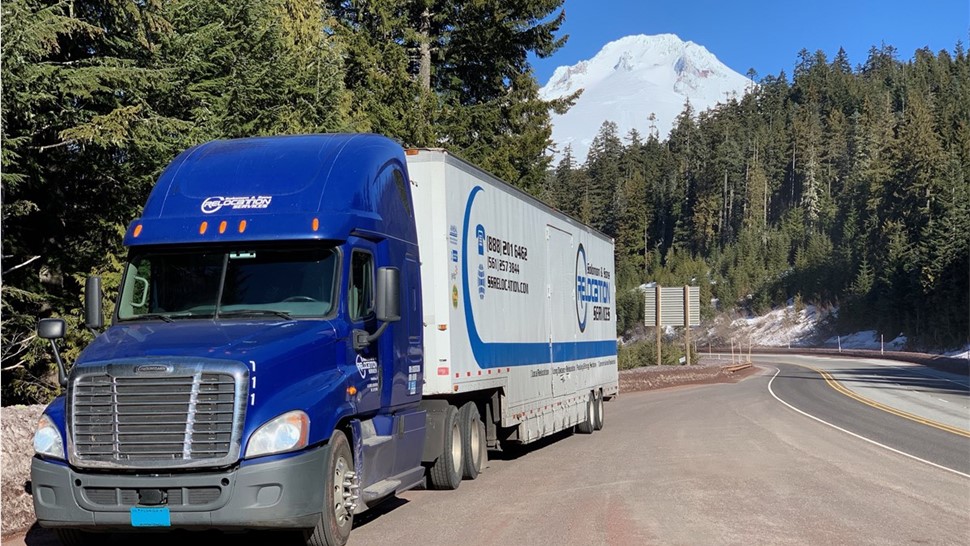 long distance moving truck in forest