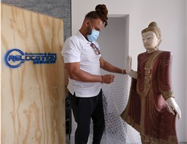 Solomon & Sons mover preparing a high value item for a move with custom crating.