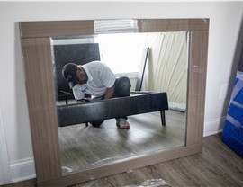 Ft. Lauderdale movers assembling a coffee table.