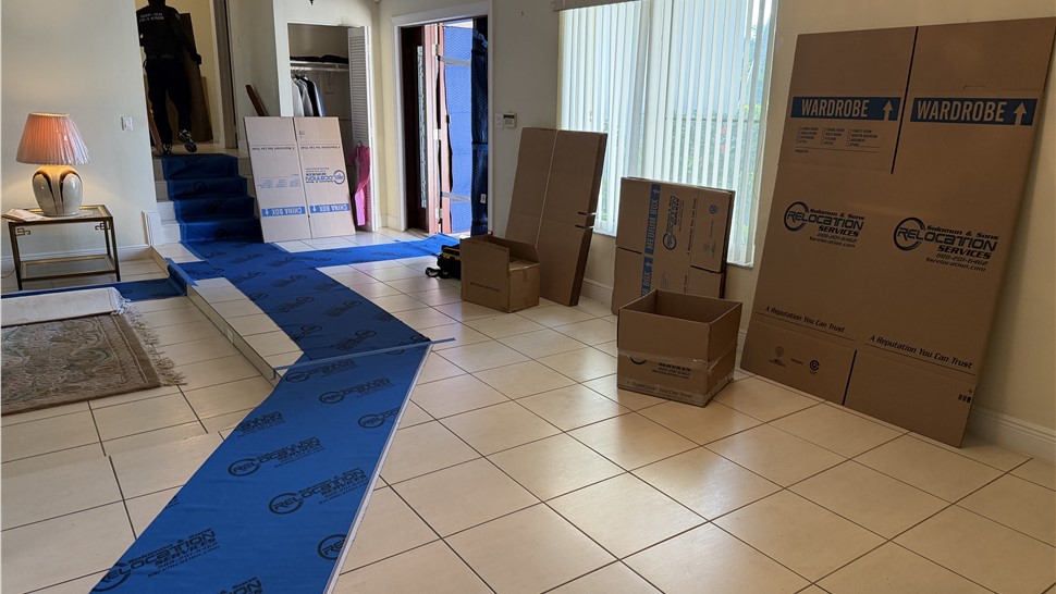 Miami movers using floor and stair protection during full-service residential move