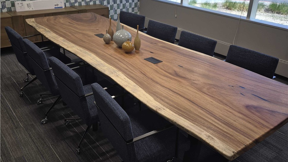 Large conference room table and chairs relocated during a Denver regional office move by Solomon & Sons Relocation Services.