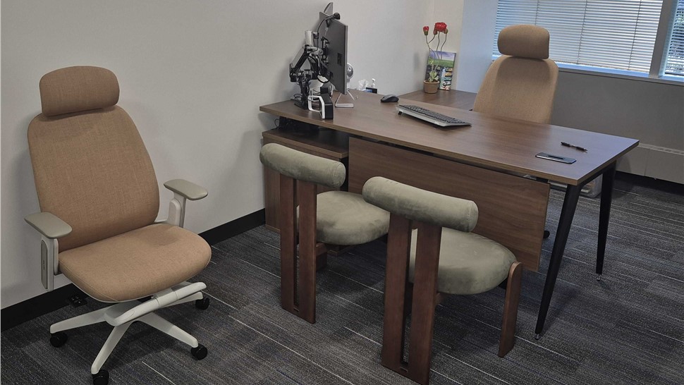 Private executive office with desk, chairs, and workstation relocated by Solomon & Sons during a Denver office move.