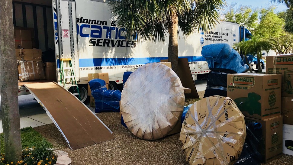 Movers packing furniture and boxes for long-distance move in South Carolina