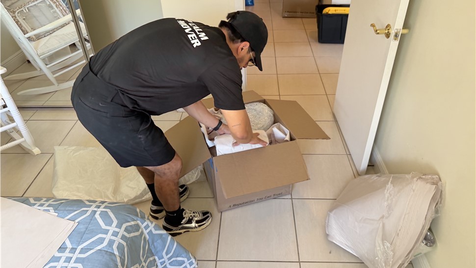 Professional household packing service by Miami movers for interstate relocation