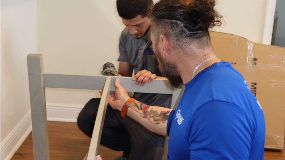 Solomon & Sons movers carefully disassembling furniture before transportation and storage
