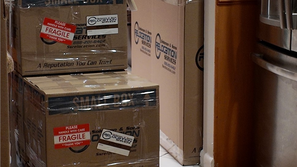 Packed and labeled Solomon & Sons moving boxes ready for transport