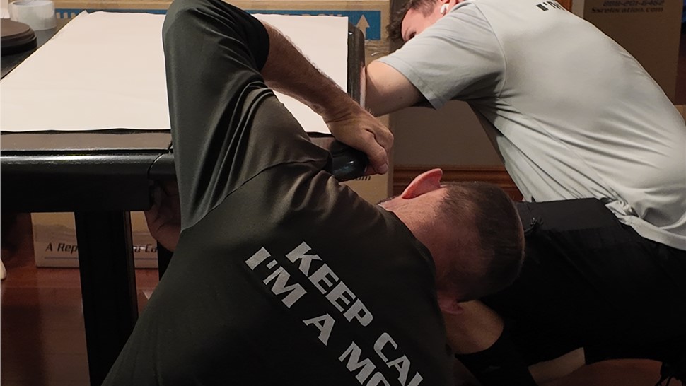 Solomon & Sons movers disassembling furniture for a residential move