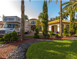 Solomon & Sons moving truck parked near the front yard of a Florida home during a residential move.