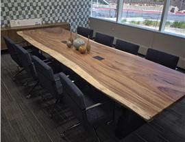 Large conference room table and chairs relocated during a Denver regional office move by Solomon & Sons Relocation Services.