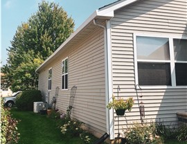 Gutters Project in Romeoville, IL by Stan's Roofing & Siding