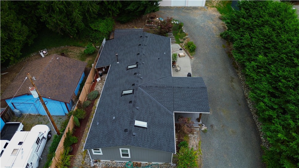 Stanwood WA roof replacement GAF Timberline HDZ charcoal front aerial