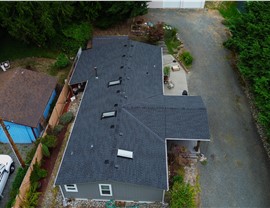 Stanwood WA roof replacement GAF Timberline HDZ charcoal front aerial