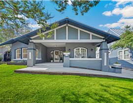 Residential home with white replacement windows and updated exterior