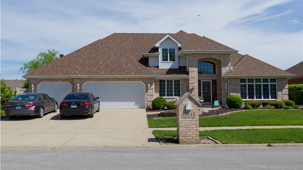 "Beautiful roof with Owens Corner Desert Rose Shingles by TTLC Inc. in Orland Park, IL."