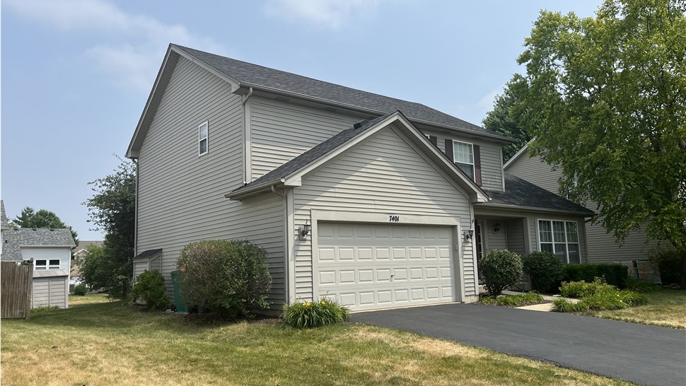 TTLC Inc.: Expertly Installed Owens Corning Black Sable Shingle Roof Enhancing the Side of a House in Plainfield, IL