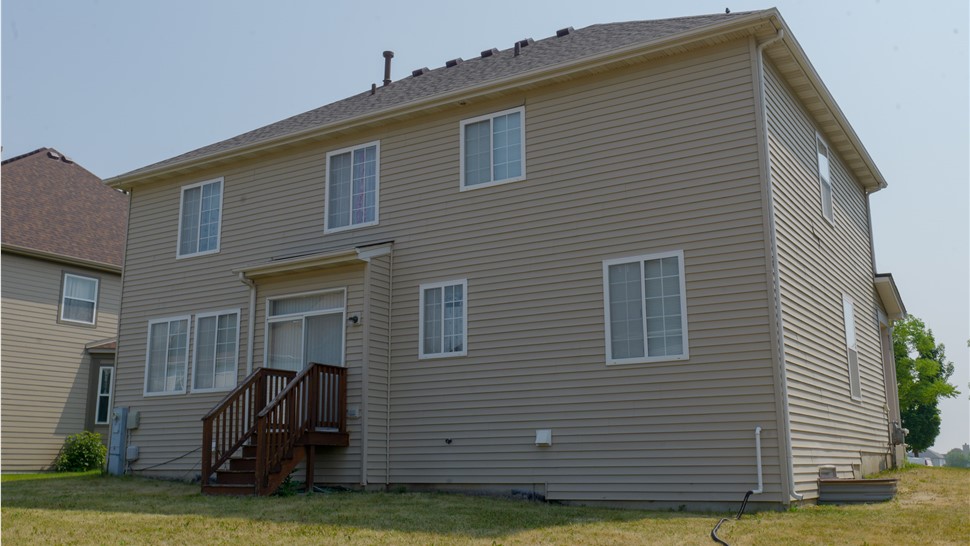 Stunning architectural transformation showcasing Peppercorn Shingles by Owens Corning installed by TTLC. Inc in Joliet, IL, creating an outdoor haven with unrivaled elegance and charm.