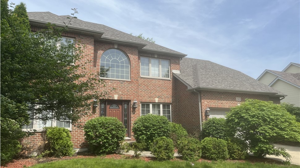 "Roof adorned with Owens Corner Driftwood Shingles, showcasing their natural charm and long-lasting quality."