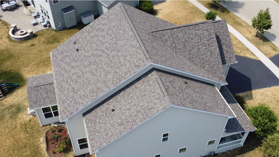 Stunning Architectural Transformation: TTLC Inc. Showcases Owens Corning Driftwood Shingles on Joliet, IL House, Evoking Timeless Style