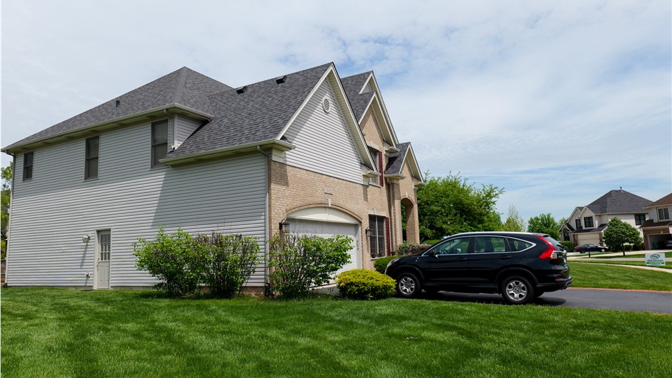 "Roof with Owens Corner Peppercorn Shingles, showcasing their sleek and contemporary appearance."