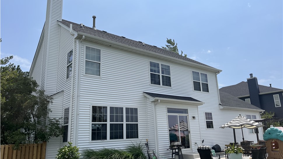 Siding project in Plainfield, Illinois; Variform "Colonial White" siding installation