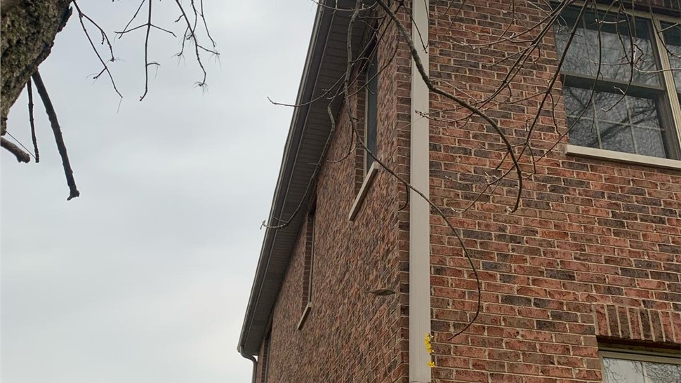 Newly installed roof and seamless gutters on a home in Arlington Heights, IL.