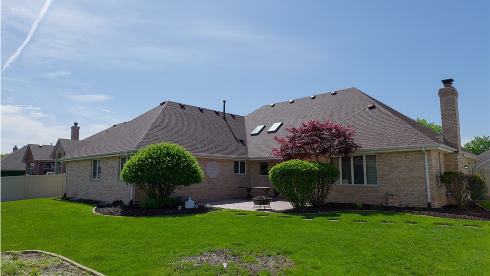 "Roof with Owens Corner Desert Rose Shingles by TTLC Inc. in Orland Park, IL."