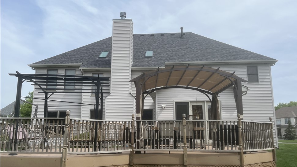 Roof featuring Owens Corner Williamsburg Grey Shingles, exemplifying enduring elegance and superior durability."