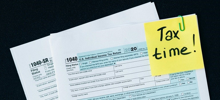 a sticky note on tax papers