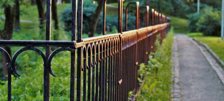 Iron fence along a landscaped walkway