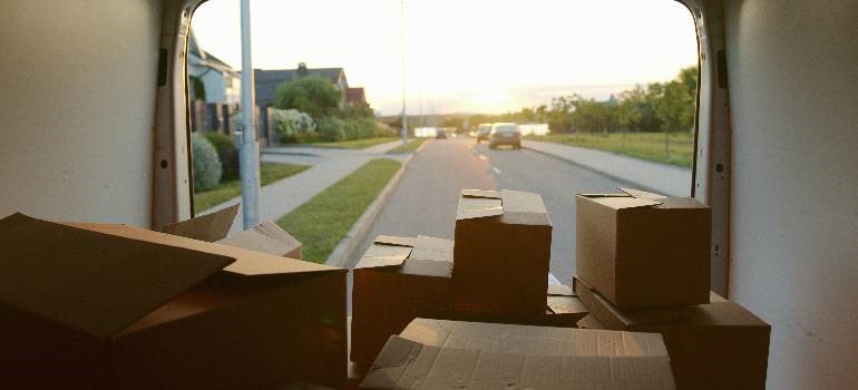 packed boxes in a van of the people who are moving to Redwood City.
