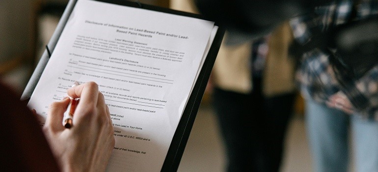Manager reviewing relocation paperwork