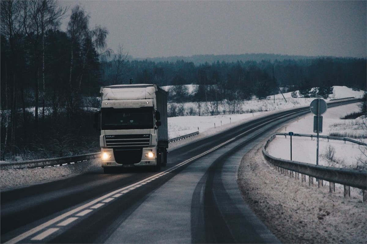 a truck on a snowy road 