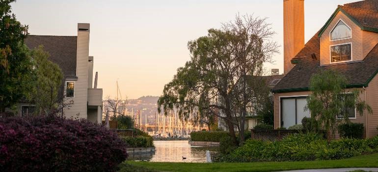 Waterfront view with residential homes, ideal for those moving to Alameda CA.